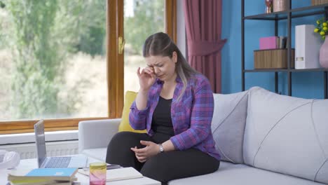 Home-alone-young-woman-crying.