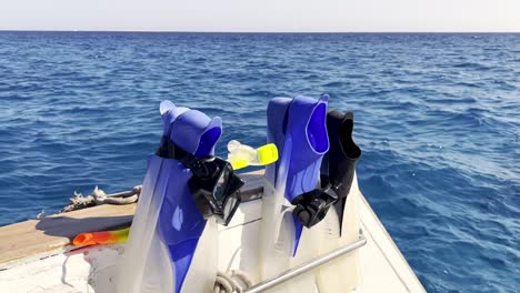 closeup of scuba fins on diving boat in sea