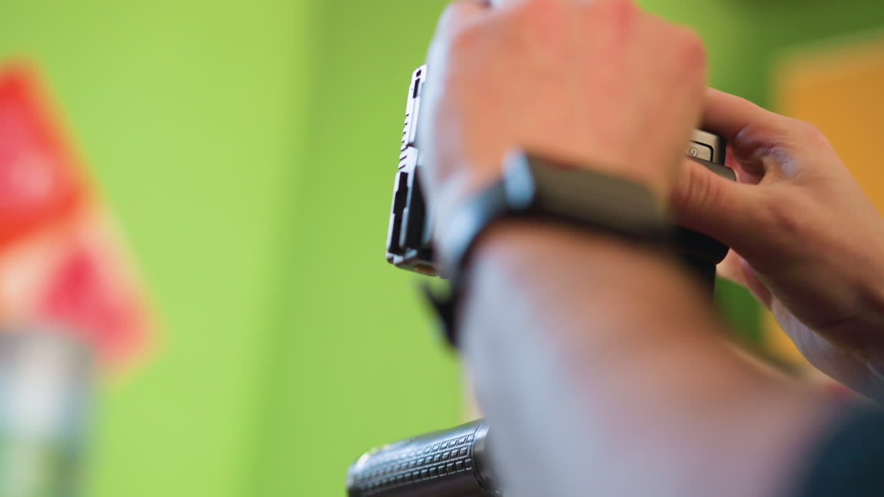 close-up shot of hands adjusting camera gear, focusing on video camera setup. preparation for filming, adjusting gear for video production. handheld equipment in professional setup