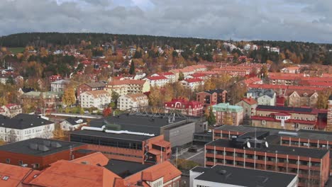 -Close-flyby-church-tower-of-Ostersund-city-in-Sweden-on-fall-day