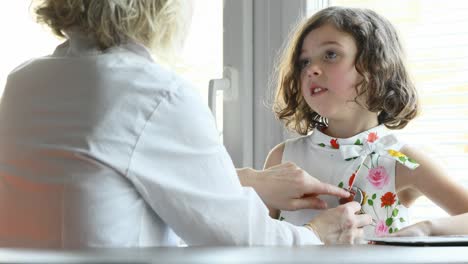doctor checking her little patient