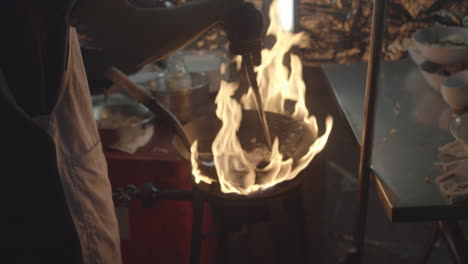 cooking show at the street food market in chinatown bangkok, thailand - slow motion