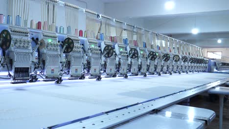 View-Along-Row-Of-Automatic-Fabric-Embroidery-Machines-At-Garment-Factory-In-Karachi