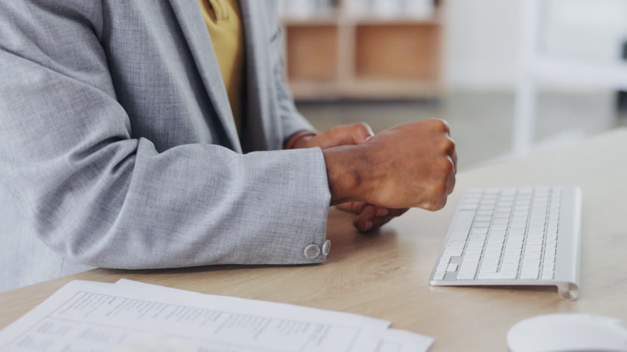Hands of business man typing with pain