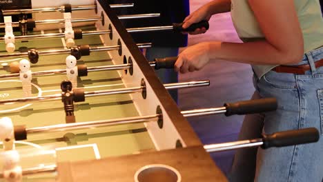 players engaged in a lively foosball match