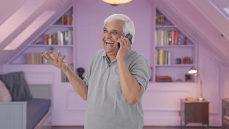 Happy-Indian-old-man-talking-on-call