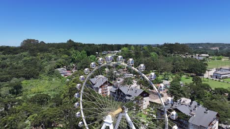 canela brazil. stunning ferris wheel at canela in rio grande do sul brazil. downtown district. ferris wheel landscape. amusement park. stunning ferris wheel at canela in rio grande do sul brazil.