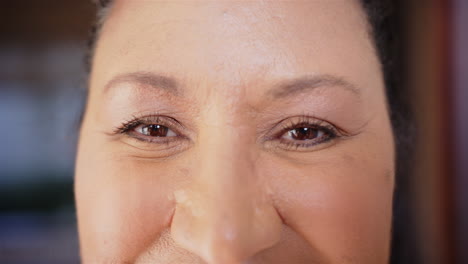 close-up of woman's eyes and nose, showing natural beauty and confidence