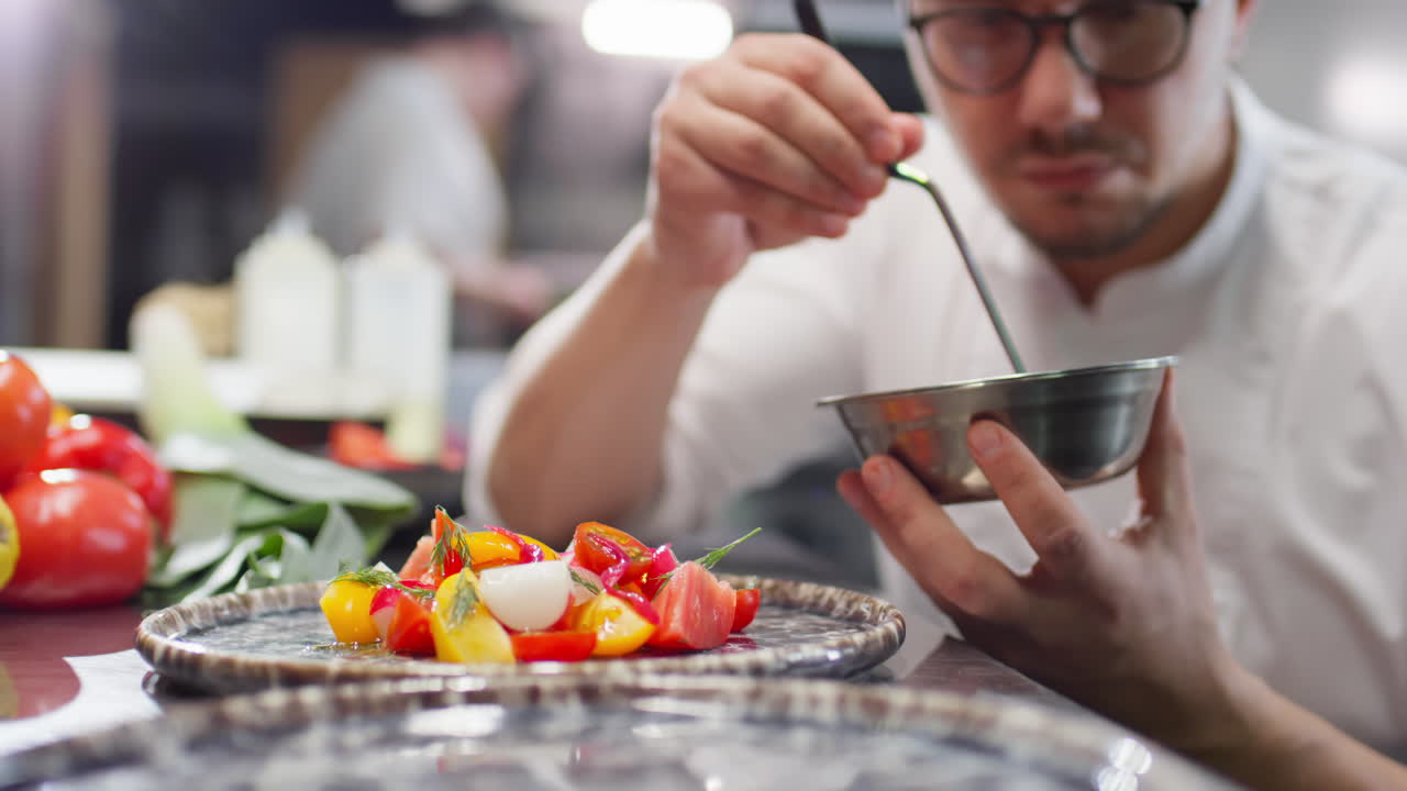 Chef Garnishing Salad with Pickled Onion