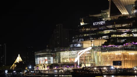 illuminated buildings and reflections on water at night