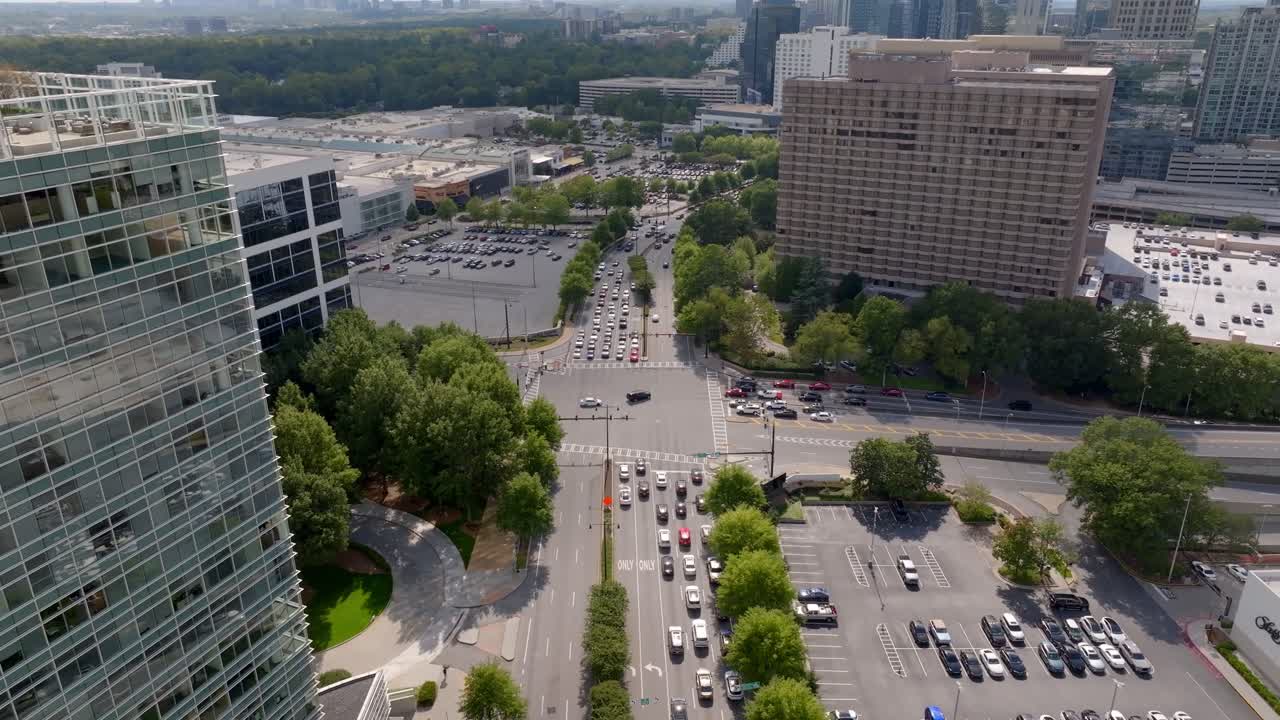 Aerial of Peachtree Road big parking lots, parkway near department stores, Atlanta, Georgia, Panoramic view