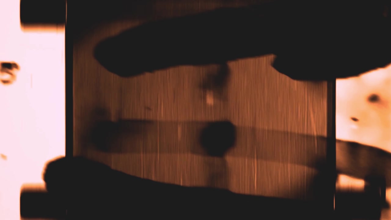 Vintage Film Reel Leader with Red Light Leaks and Scratches