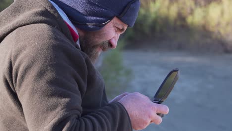 Drone-Pilot-looking-at-the-screen-of-the-command---Lateral-Medium-Shot-Slowmotion