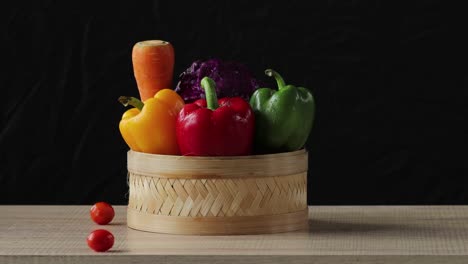 fruits on the basket with with tomatoes rolling movement