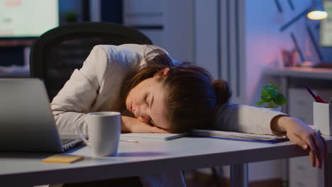 exhausted overload business woman falling asleep on desk