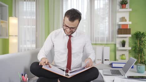 Happy-and-cheerful-working-businessman-is-pleasant-and-peaceful.