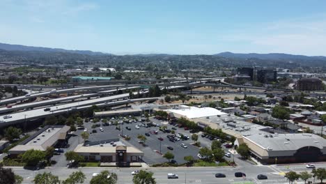 wide aerial drone view of san mateo cityscape, busy streets, california, usa