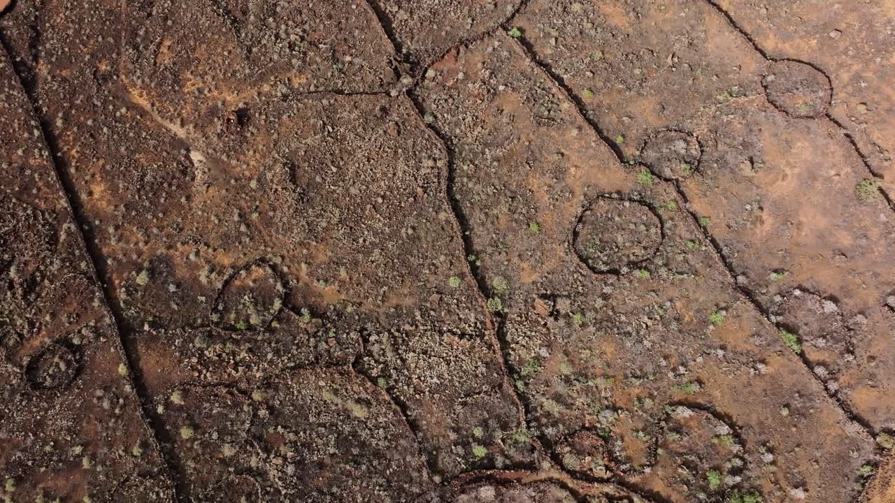 Volcanic terrain, El Hierro Island, intricate cracks and textures visible, drone