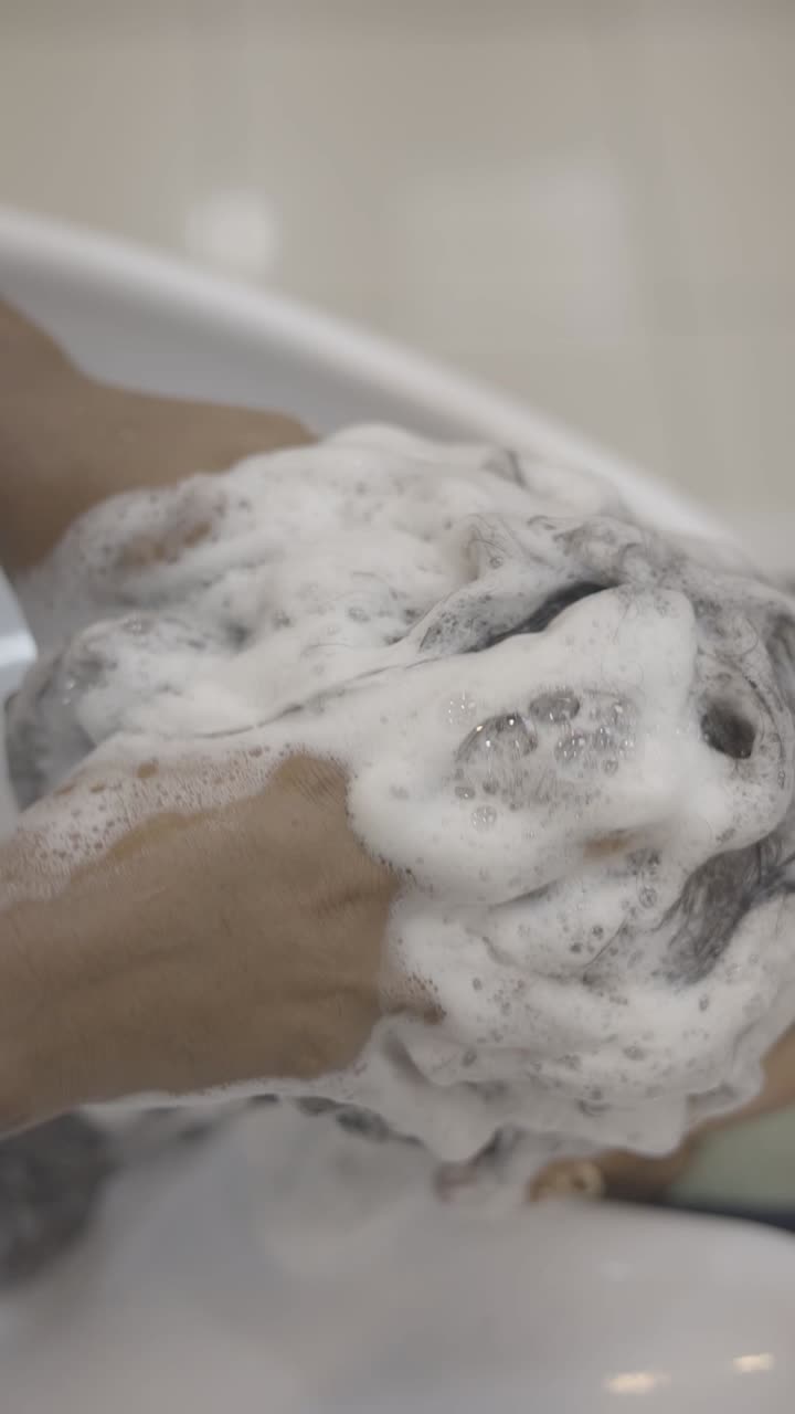 Close-up of hair washing with shampoo