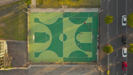 local basketball team running beep test on outdoor basketball court