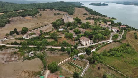 nanclares de gamboa village in basque country, spain, with lake and castle, aerial view