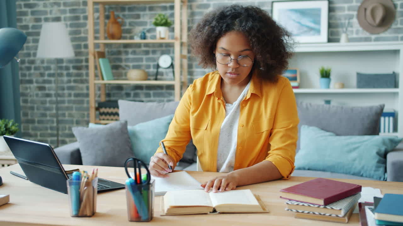 Teenage girl studying at home