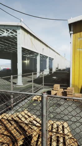 a warehouse with a metal gate and pallets