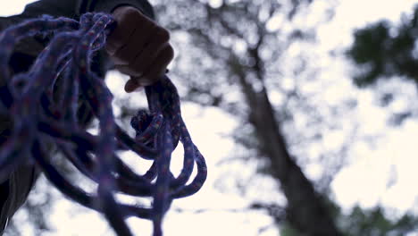 Guy-brings-a-rope-into-the-woods