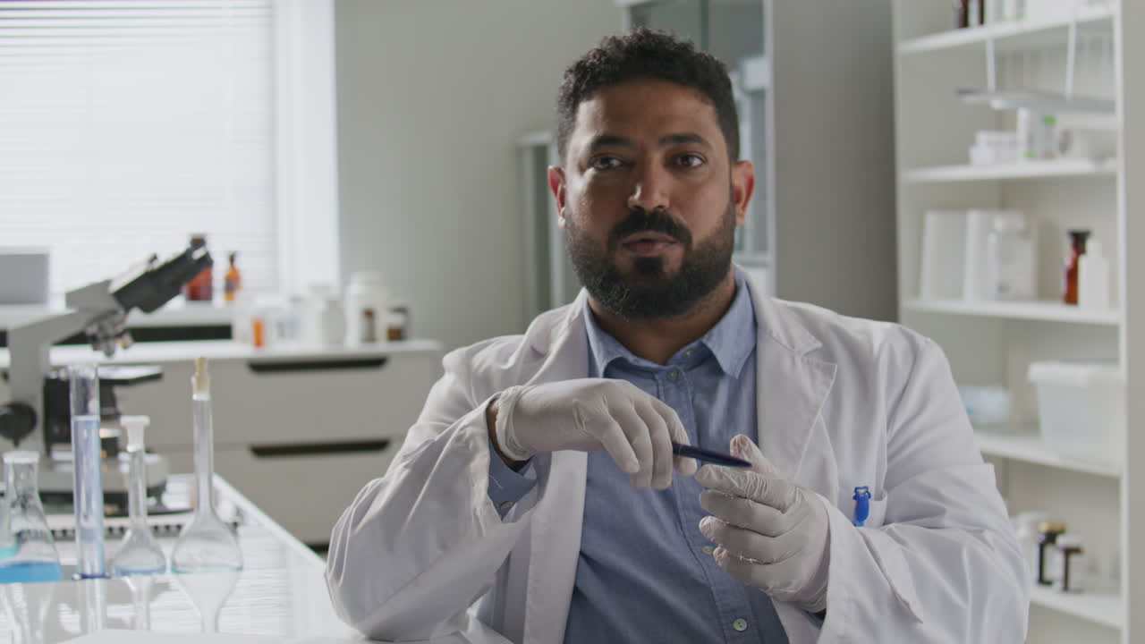 Scientist Explaining Ideas to Camera during Video Call in Laboratory