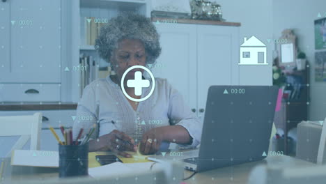 animation of data processing over senior african american woman using laptop