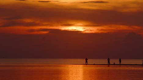 sunset beach silhouettes
