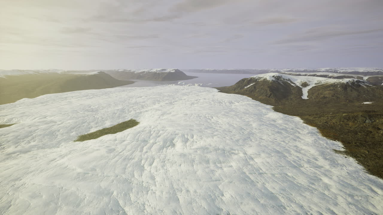 Vast ice expanse stretches across dramatic mountain landscape in remote area