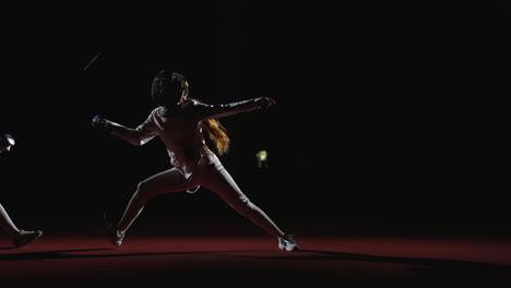 female fencing athletes in action