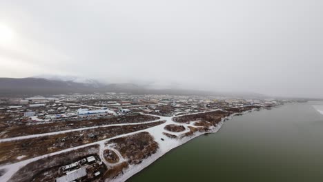 experience the enchanting beauty of yakutia as the first snow transforms the landscape into a winter wonderland. aerial shots reveal a serene and tranquil atmosphere, showcasing nature's artistry.