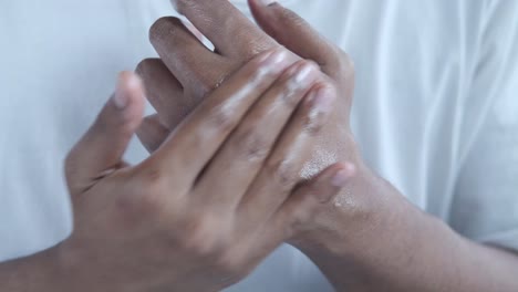 applying lotion to hands and wrist