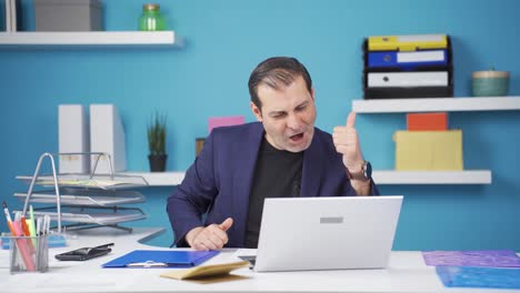 Businessman-feeling-positive-gesture-on-laptop.