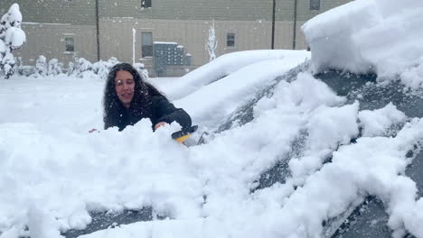 Girl-Clearing-Snow-From-Windshield-of-Car-During-a-Snowfall,-4K