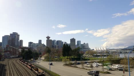 wide angle view of canada place and cityscape buildings from waterfront train station in vancouver, canada