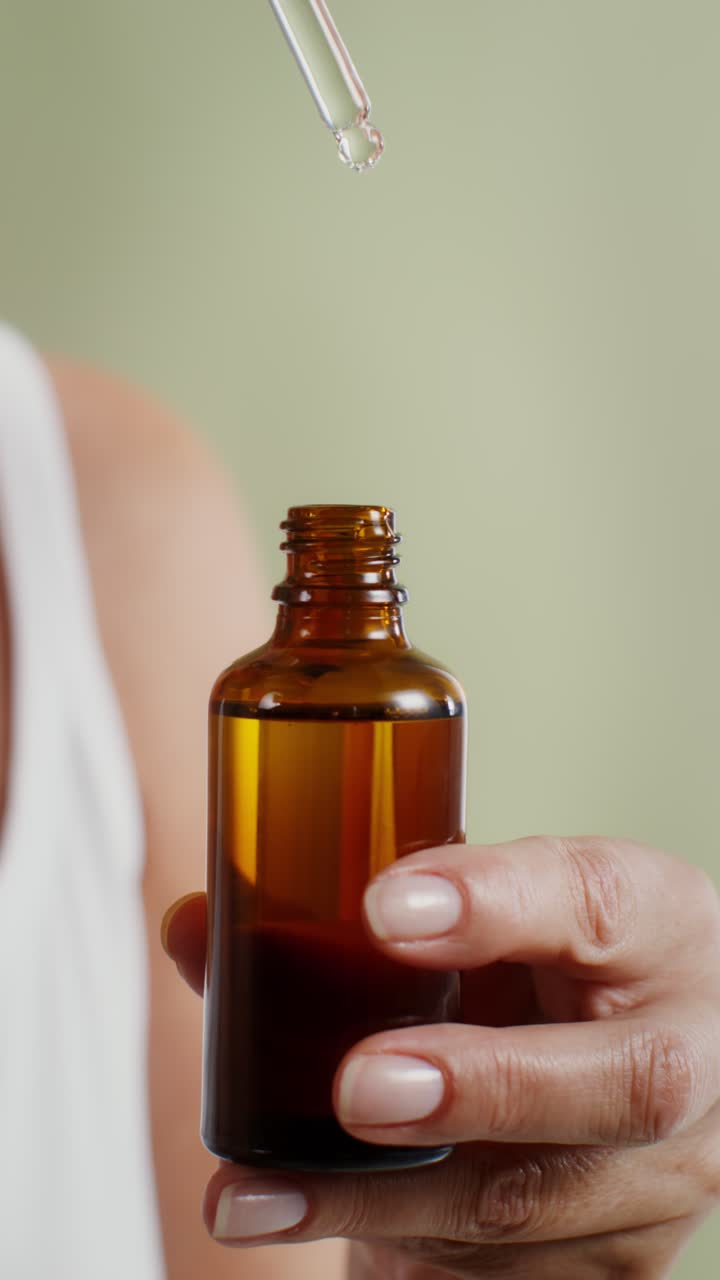 Serum or Essential Oil being applied with a dropper