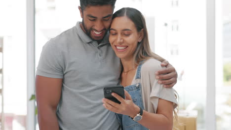 Phone,-smile-and-couple-kiss-in-home