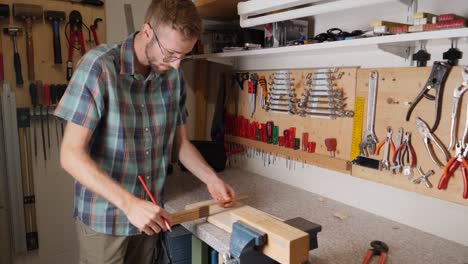 Taking-measurements-for-wood-works-at-home-diy-studio