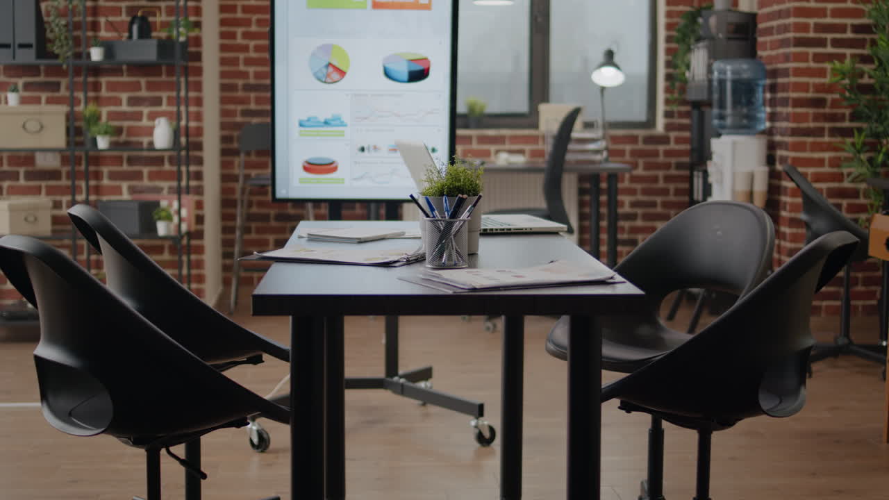 Close up of meeting table and monitor in business office