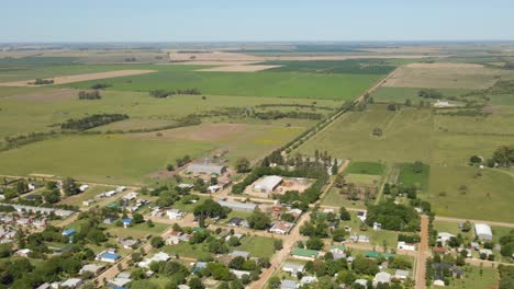 Aerial-view-parallax-of-little-town-of-Santa-Anita-with-Entre-Rios-green-countryside-in-background,-Argentina
