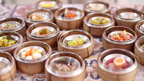 assorted dim sum baskets displayed on a table