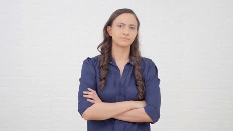 Confident-Indian-girl-standing-crossed-hands