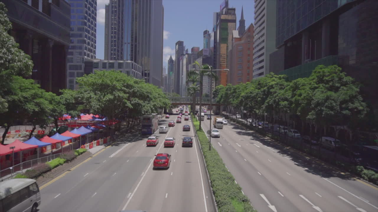 Establishing shot of Asian city with traffic going both ways from high angle