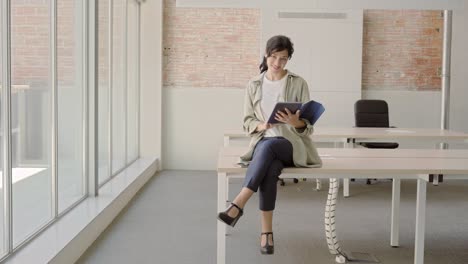 businesswoman working in the office sitting at the table. female entrepreneur starts her startup.