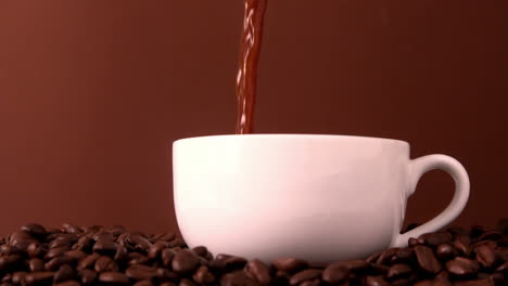 Hot-coffee-pouring-into-white-cup