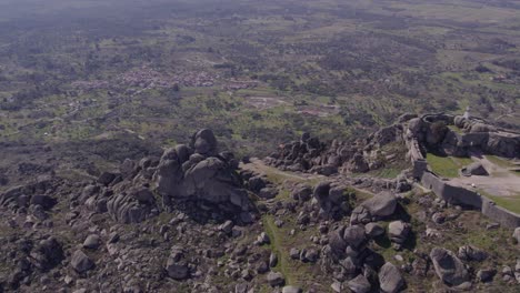 Orbit-shot-of-Castelo-de-Monsanto-Portugal-during-day-time,-aerial