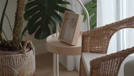 cozy wicker chair with plant and decor in a bright interior